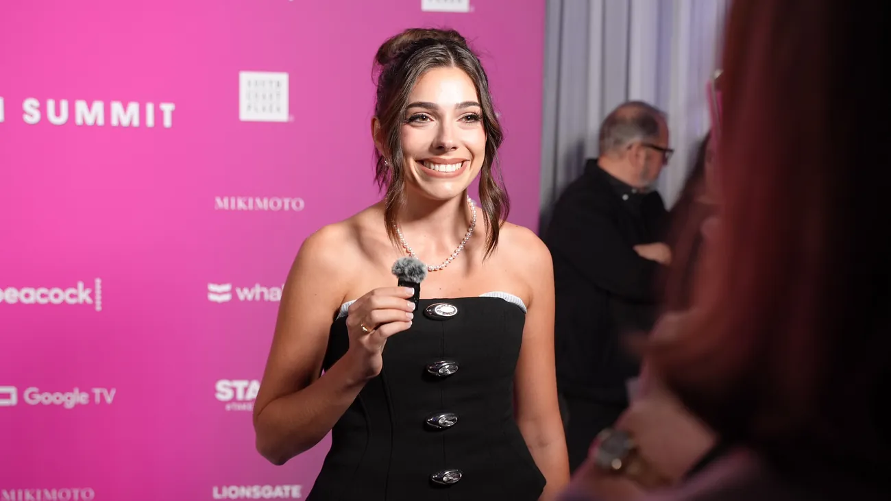 Taylor Price giving a red carpet interview at TheWrap Power Women Summit
